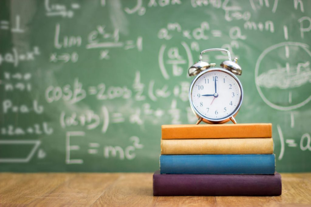 Clock on pile of books